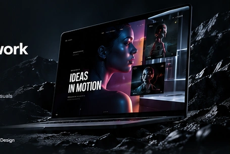 Creative motion design displayed on a laptop in a cinematic rocky landscape